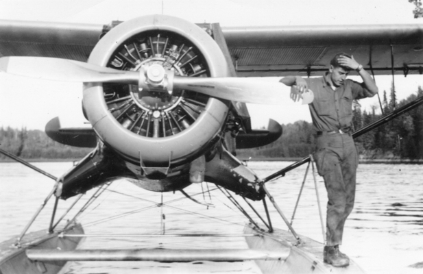 Reguly stands on pontoon airplane